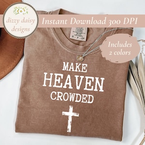 Puede incluir: Una camiseta marrón con el texto "MAKE HEAVEN CROWDED" y una cruz blanca. La camiseta incluye el texto "Includes 2 colors" y "Instant Download 300 DPI". Un collar plateado con un colgante está sobre la camiseta.