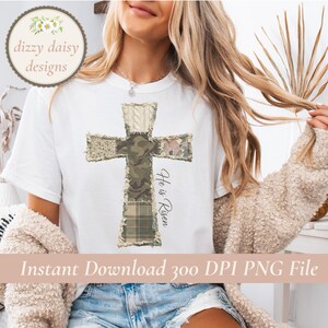 May include: White t-shirt featuring a patchwork cross design with camouflage, knit, and plaid patterns. The words "He is Risen" are written vertically on the right side of the cross. The image also includes the text "Instant Download 300 DPI PNG File".