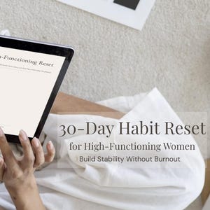 May include: A black tablet shows the text "The High-Functioning Reset" and "30-Day Habit Reset for High-Functioning Women." The tablet is held by a person on a white surface. The image is a digital download.