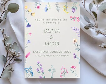 以下が含まれることがあります： 水彩画のフローラルボーダーが付いた結婚式の招待状。「You're invited to the wedding of OLIVIA & JACOB, Saturday, June 28, 2026, 17 Lombard St. San Diego.」と書かれています。