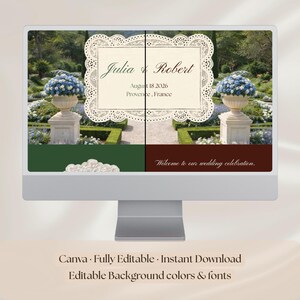 May include: A computer monitor displays a wedding invitation design. The invitation features the names "Julia & Robert," the date August 18, 2026, and location Provence, France, set against a garden backdrop. Text at the bottom reads "Welcome to our wedding celebration."