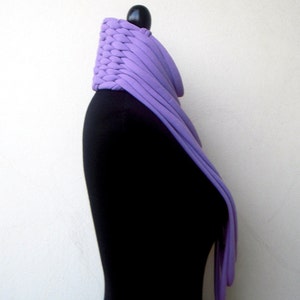 May include: A purple knitted cowl neck scarf on a black mannequin.