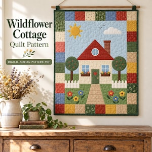 May include: A wall hanging quilt featuring a cottage scene with a red roof, brick chimney, and white picket fence, surrounded by a patchwork border. The text reads Wildflower Cottage Quilt Pattern and DIGITAL SEWING PATTERN PDF.