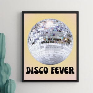 May include: A set of three ceramic mugs with a speckled, cream-coloured glaze. Each mug features a different hand-painted design: a blue and green leaf, a yellow flower, and a red berry. The mugs have a simple, modern design.