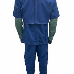 May include: A blue jumpsuit with short sleeves and a high collar. The shoulders have gray padded accents. The sleeves are green with a geometric pattern. The pants are blue and have a seam down the front.