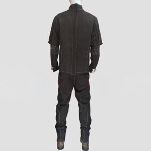 May include: A dark brown two-piece outfit displayed on a mannequin. The outfit includes a jacket with short sleeves and decorative stitching, and matching pants. The sleeves have a patterned design. The outfit is made of a sturdy material.