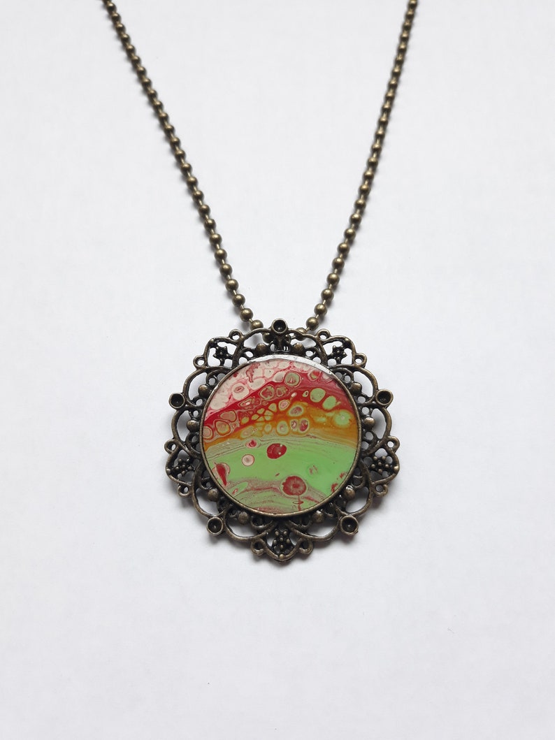 Pendant necklace with fluid paint design