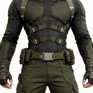 May include: A tactical outfit in black and olive green. The ensemble includes a high-collared jacket with padded sections, a utility belt, cargo pants, and fingerless gloves. The outfit has multiple straps and pockets.