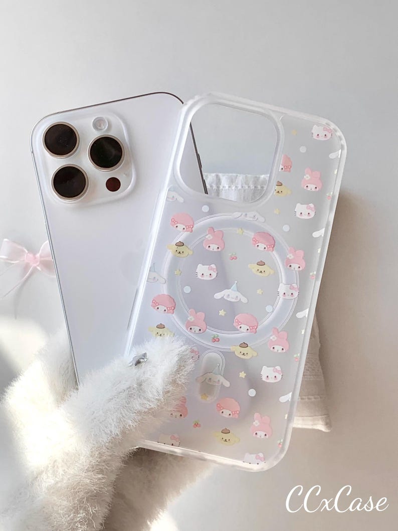 May include: A clear phone case with a pattern of cartoon characters in pink, yellow, and white. The case is shown with a white phone. The text "CCxCase" is visible in the bottom right corner.