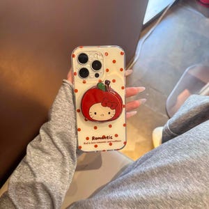 Funda para teléfono Red is Love con temática romántica de lunares, soporte magnético con forma de manzana de Hello Kitty, compatible con MagSafe para iPhone 15/16/17 Pro Max imagen 6