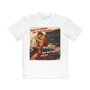 May include: White t-shirt with a retro graphic. The design shows a couple embracing with the text: "Want to collapse the waive function into bed together and get entangled?" and a heart symbol.