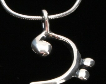 Bass Clef Pendant - on black nylon cord