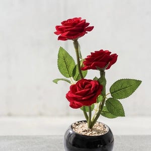 May include: A rustic wooden sign with the text "Welcome to our home" in white lettering. The sign features a distressed finish and a simple, inviting design, perfect for entryway decor.