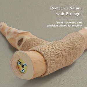 May include: A T-shaped hardwood perch wrapped in tan jute rope. The end shows a circular metal mounting plate with three screws and a threaded center hole. Text reads: Rooted in Nature with Strength. Solid hardwood and precision drilling for stability.