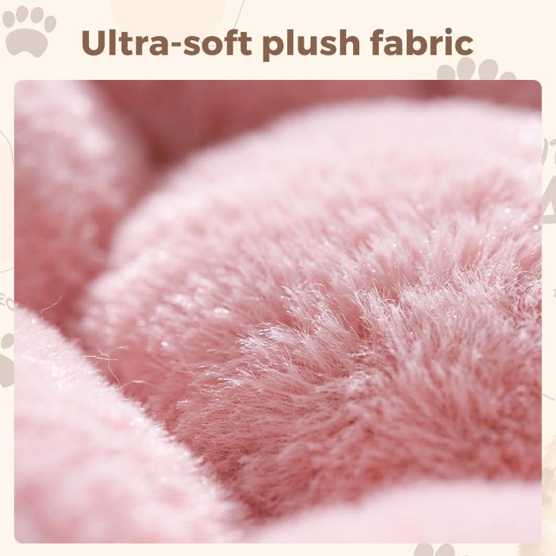 May include: Close-up of a soft, pink plush fabric. The image highlights the texture and density of the material, with visible fibers and a fluffy appearance. Text at the top reads "Ultra-soft plush fabric".