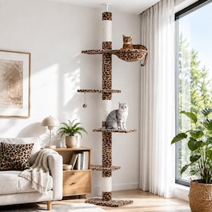 May include: A floor-to-ceiling cat tree featuring a central tension pole, multiple platforms, and a hanging hammock. The structure is covered in a brown and black leopard print fabric and cream-colored sisal rope, with two cats resting on it.