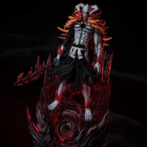 May include: A detailed figurine of a character with white skin, orange hair, and a black outfit. The figure is posed with a red sword and stands on a red, textured base. The background is dark, emphasizing the figure's features.