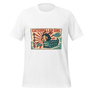 May include: White t-shirt featuring a colorful graphic of a woman as a caterpillar. The design includes the text "CATERPILLAR GIRL" in red and Japanese characters. The caterpillar is blue and green.