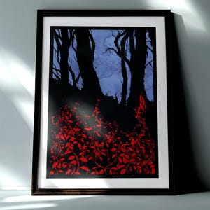 May include: Framed art print featuring a dark forest scene. Silhouetted trees against a blue and purple sky, with vibrant red foliage in the foreground. The artwork is in a black frame.