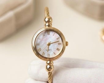 Reloj ajustable de oro / pulsera retorcida