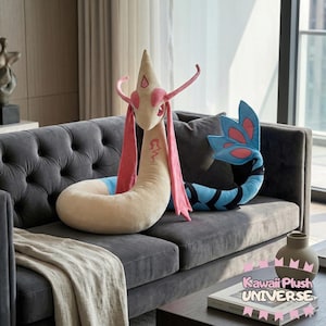 May include: A plush toy of a serpentine creature with a beige body, pink accents, and a blue tail, resting on a gray sofa. The toy has a long, slender neck and a pointed head. The tail is blue with black stripes and pink details. The plush is a decorative item.