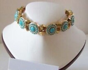 Bracelet Turquise stretch bracelet set 8 inches with matching drop earrings 1/12 inches long. 6 MM gold crystals