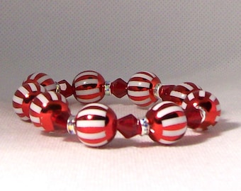 Bracelet-red and white striped stretch bracelet 12 mm round beads with 6mm red bicone beads and crystal spacer beads