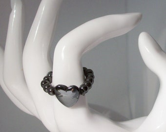 Ring-Hematite stretch ring with center 14 mm heart bead/4mm hematite beads for band  size  8 inch