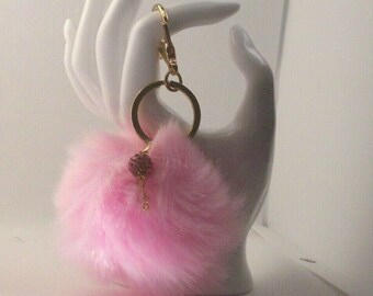 Keychain Pink pom poms with a Shamballa bead drop 3 and half inches Long 6 inches around