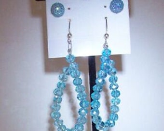 Earrings - Pair of light blue crystal hoop earrings and 1 pair of post earrings.