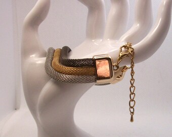 Bracelet 3 round mesh strands Gold, Silver and black bracelet base is 7 inches long with 3 inch extention chain