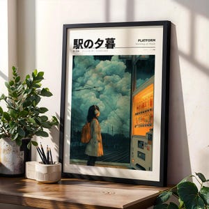 May include: Framed art print featuring a person wearing headphones and a backpack, standing on a train platform. The artwork has Japanese text and a title that reads "Platform Waiting at Dusk". The background shows a vending machine and a cloudy sky.