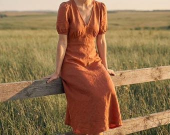 Vestido midi de lino, escote en V, mangas abullonadas, color terracota óxido, estilo bohemio para el verano.