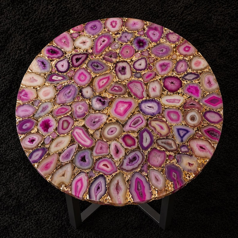 Contemporary round agate center table with pink crystal texture and luxury decor
Modern black metal coffee table featuring natural agate stone mosaic tabletop