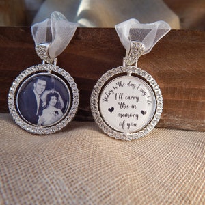 May include: Two circular silver-toned pendants framed with clear rhinestones. One pendant features a black and white photograph of a couple. The other pendant displays the text: Today is the day I say I do, I'll carry this in memory of you.