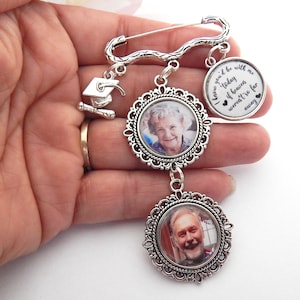 May include: A silver charm bracelet with two photo charms and a graduation cap charm. The photo charms feature a woman and a man. The charm bracelet also includes a charm with the text "I knew you'd be with me today if heaven weren't so far away".
