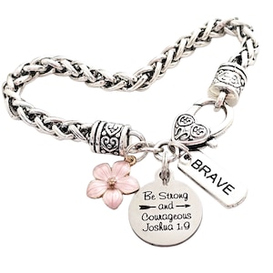 May include: Silver chain bracelet with a heart charm, a flower charm, and two round charms with the text "Be Strong and Courageous Joshua 1:9" and "BRAVE".