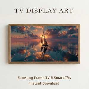 May include: A framed digital art print for TV displays. The image shows a sailboat on calm water reflecting a sunset with orange and purple hues. The text "TV DISPLAY ART" is at the top.