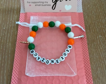Boyzone 2026 beaded bracelet with charms and gift bag