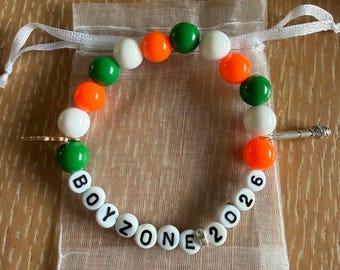 Boyzone 2026 beaded bracelet with charms and gift bag