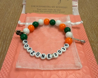 Boyzone 2026 beaded bracelet with charms and gift bag