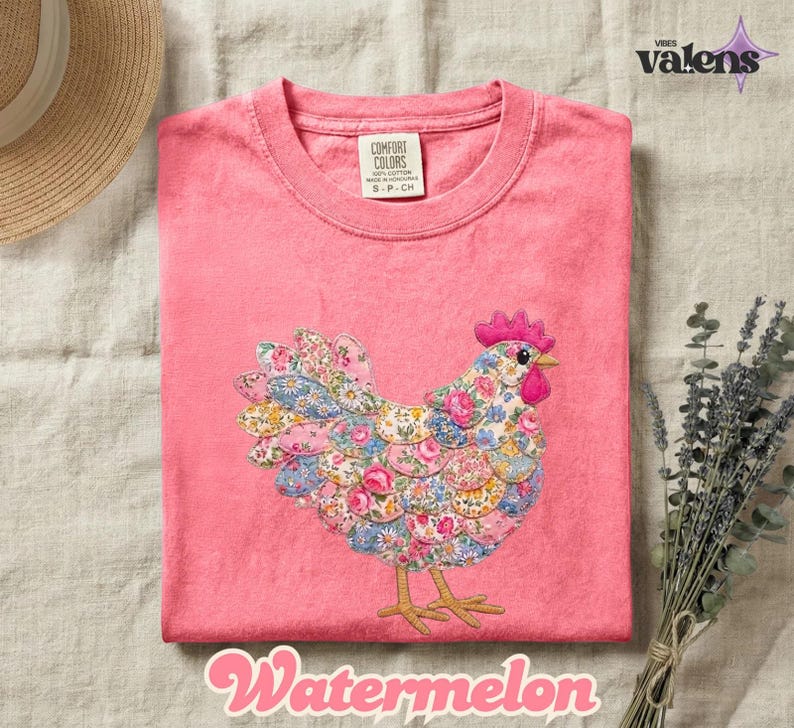 May include: A pink t-shirt with a floral chicken design. The chicken is made of fabric patches with blue, pink, and yellow floral patterns. The word "Watermelon" is written in a cursive font at the bottom.