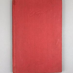 May include: A red hardcover book with the title "C. Kupp" embossed on the cover. The book has a textured surface and appears to be vintage. The spine is visible on the left side, and the book is set against a neutral background.