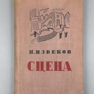 May include: A vintage book with a light brown cover. The cover features a black illustration of a stage with figures and stairs. The title "SCENA" is in red, with the author's name above it.