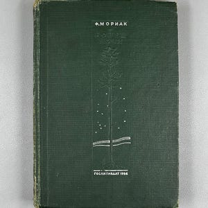 May include: A vintage hardcover book with a dark green cover. The cover features embossed text and a tree design. The book's title and author are in a foreign language. The book is from 1986.