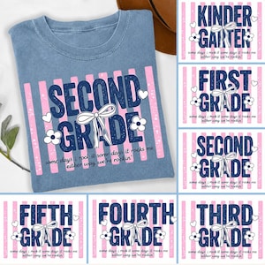 May include: A blue t-shirt featuring a pink and white striped background with dark blue text that reads SECOND GRADE. The design includes a white bow, small flowers, and hearts, with the text some days i rock it some days it rocks me either way we're rockin' printed below.