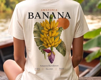 アマゾニアバナナグラフィックTシャツ、ブラジルトロピカルシャツ、ボタニカルバックプリント、熱帯雨林バケーションTシャツ、レディースオーガニックコットンTシャツ