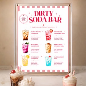 May include: A clear acrylic sign featuring a white menu titled Dirty Soda Bar in pink text. The menu lists six drink options with illustrations: Salted Caramel, Strawberry Cheesecake, Blackberry Vanilla, Brown Sugar Cinnamon, Sweet Lemon, and Blue Raspberry.
