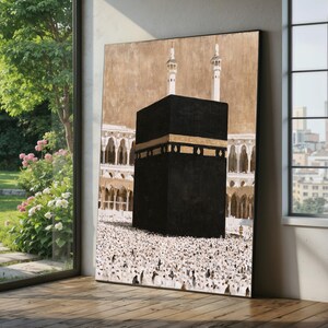 May include: A large rectangular wall art print depicting the Kaaba in Mecca. The central black cube features gold calligraphy bands. Behind it are arched architectural structures and two tall minarets against a tan background, with a crowd below.