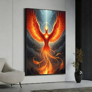 May include: A framed artwork depicts a fiery phoenix rising from flames. The bird's wings are spread wide, showcasing vibrant orange and red feathers against a dark, stormy background. A bright light emanates from above, illuminating the phoenix.